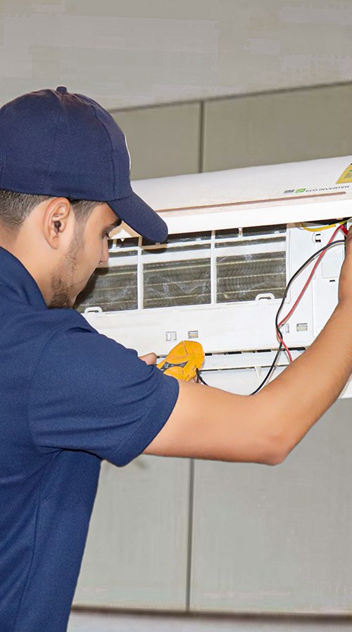 Eletox technician servicing an AC